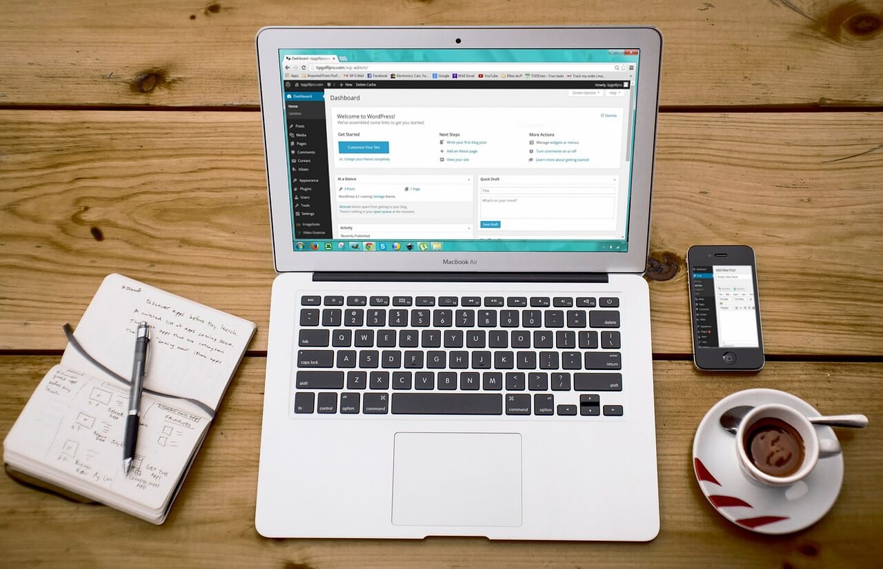 Laptop screen showing a person editing their wordpress website to improve search ranking